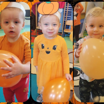 Zdjęcie przedstawia dzieci świętujące Dzień Dyni